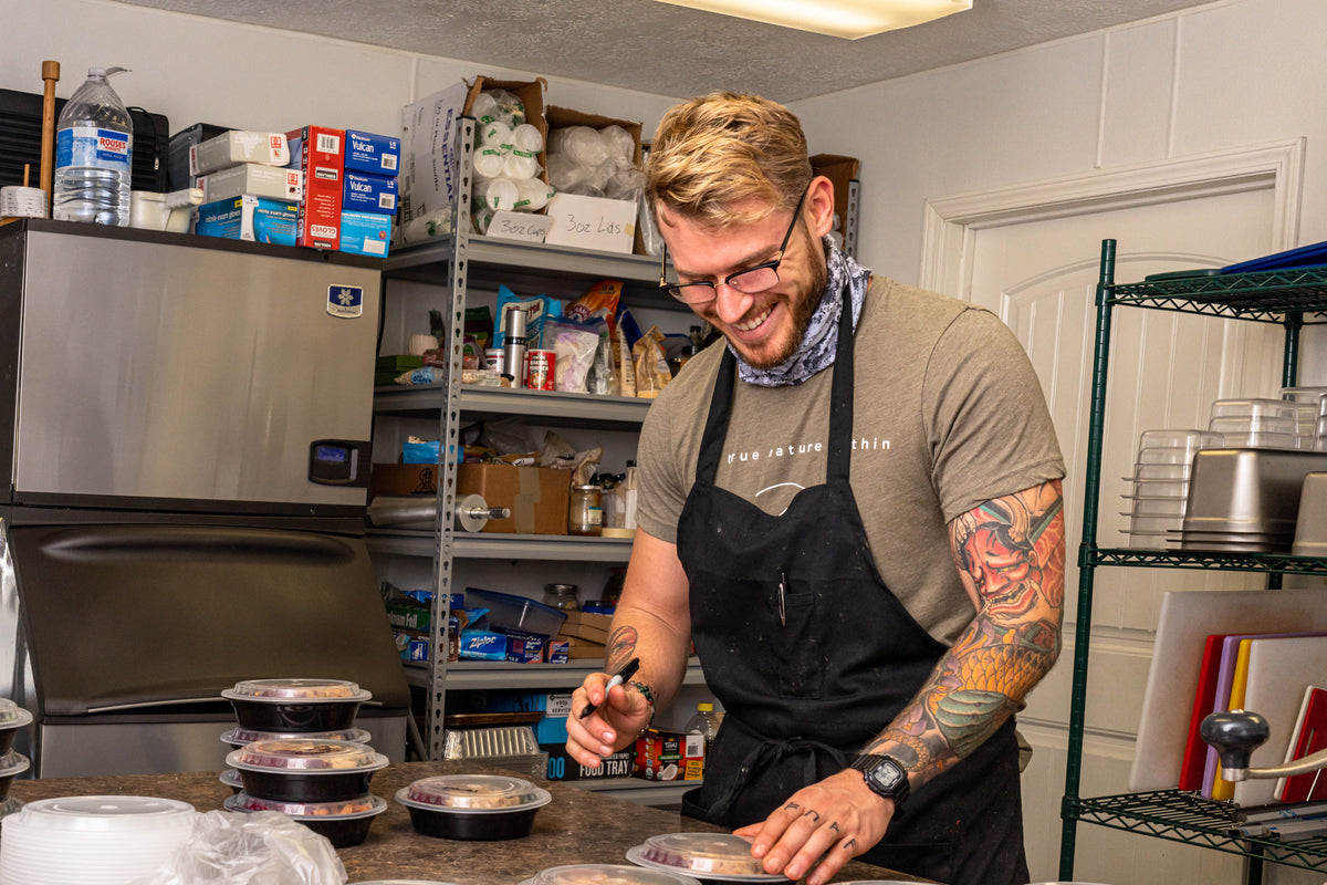 Chef Alan prepares meals in the kitchen, ready to make the week ahead easier
